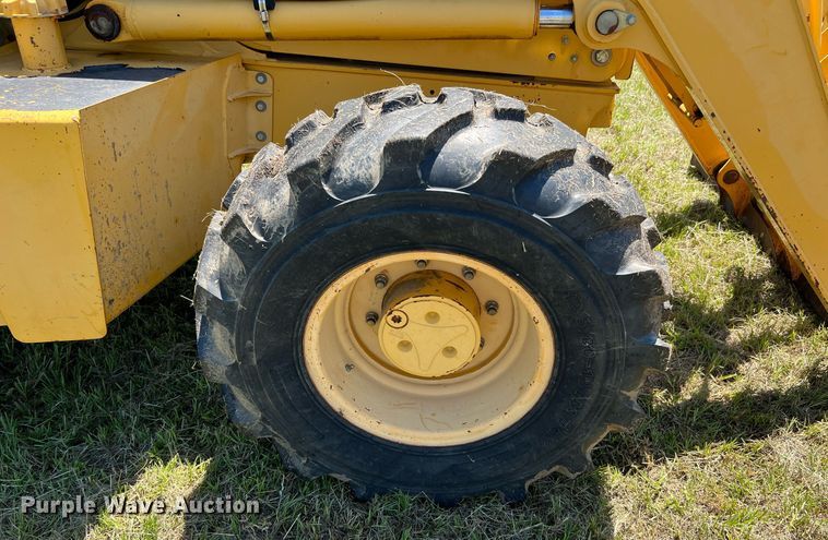 image for item DQ2055 2004 John Deere 310SG  backhoe