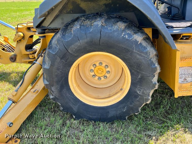 image for item DQ2055 2004 John Deere 310SG  backhoe