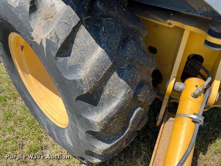 image for item DQ2055 2004 John Deere 310SG  backhoe