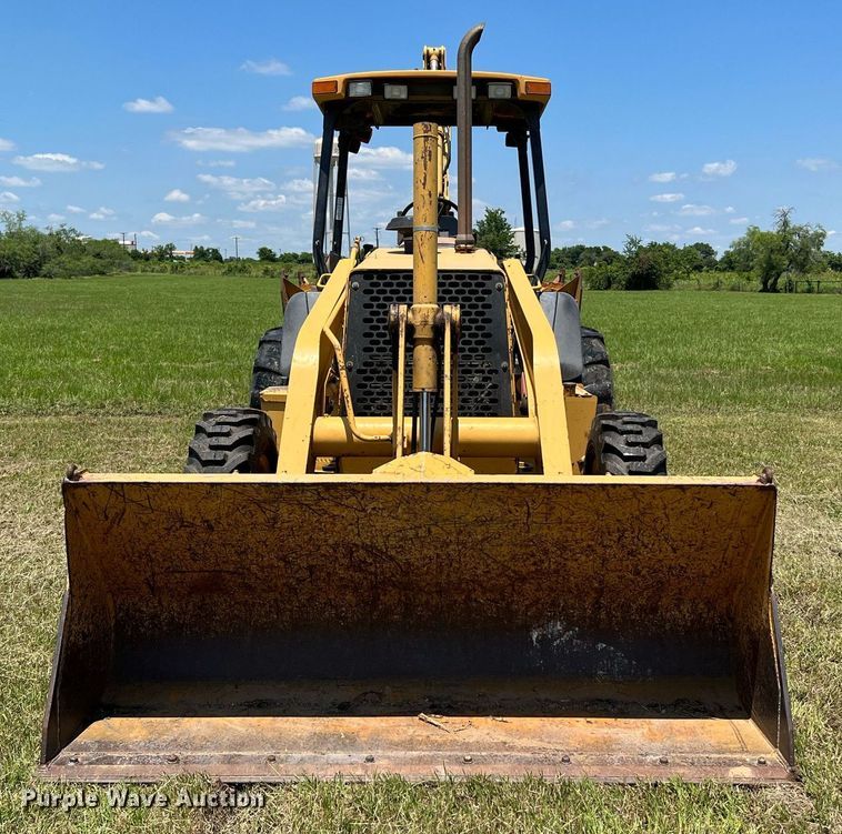 image for item DQ2056 1999 John Deere 310SE  backhoe