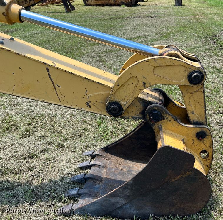 image for item DQ2056 1999 John Deere 310SE  backhoe