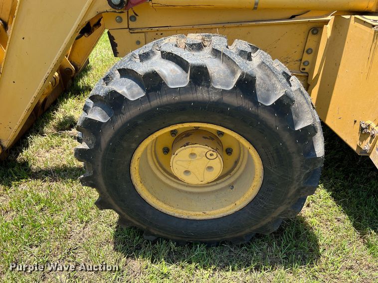 image for item DQ2056 1999 John Deere 310SE  backhoe