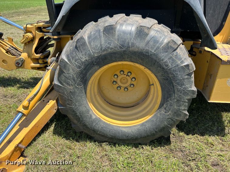 image for item DQ2056 1999 John Deere 310SE  backhoe