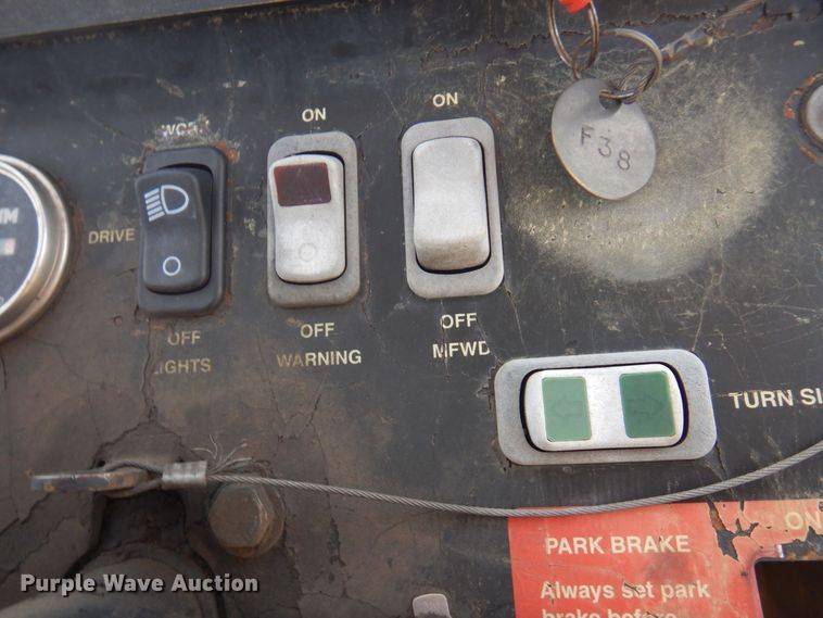 image for item DQ7319 2004 John Deere 210LE  landscape tractor