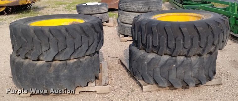 image for item LP9616 (4) 15.5-25 tires and wheels