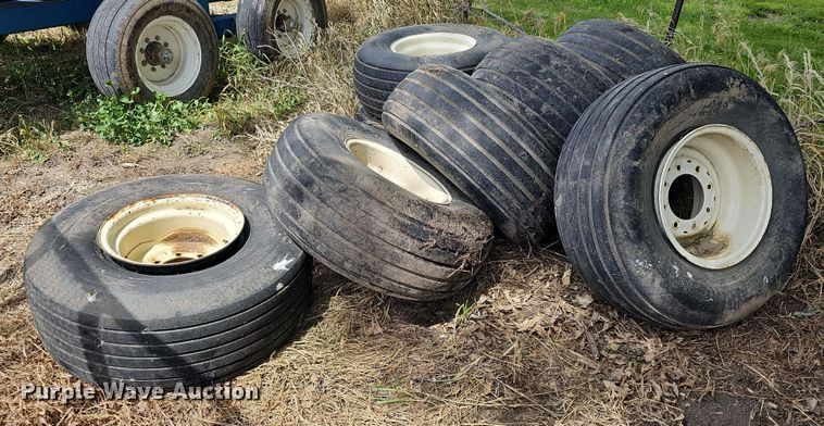 image for item MD9801 (8) 14L-16.1SL tires and wheels