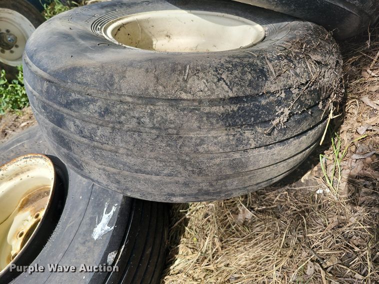 image for item MD9801 (8) 14L-16.1SL tires and wheels