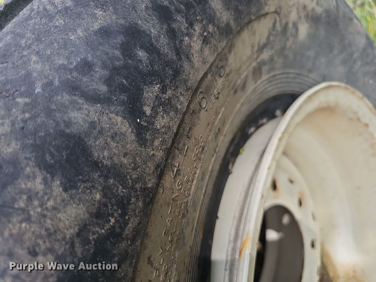 image for item MD9801 (8) 14L-16.1SL tires and wheels