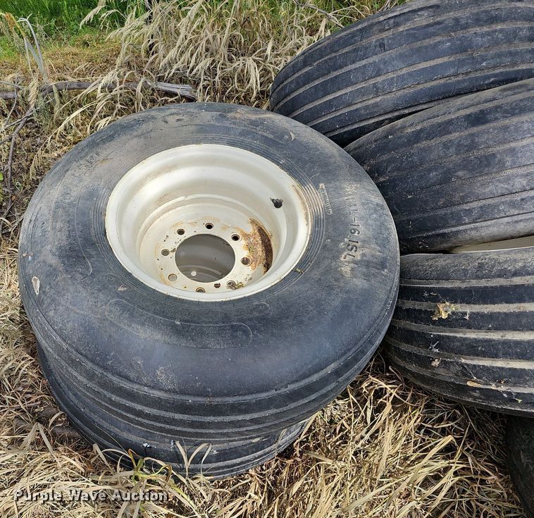 image for item MD9801 (8) 14L-16.1SL tires and wheels