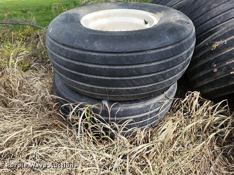 image for item MD9801 (8) 14L-16.1SL tires and wheels