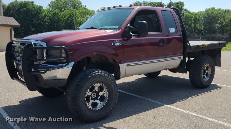 image for item DK1969 2000 Ford F250 Super Duty XLT  SuperCab flatbed pickup truck