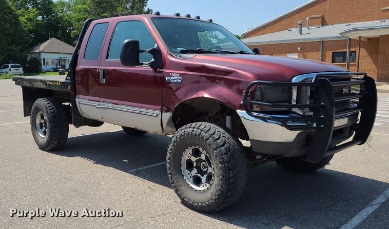 image for item DK1969 2000 Ford F250 Super Duty XLT  SuperCab flatbed pickup truck