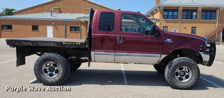 image for item DK1969 2000 Ford F250 Super Duty XLT  SuperCab flatbed pickup truck