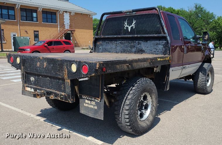 image for item DK1969 2000 Ford F250 Super Duty XLT  SuperCab flatbed pickup truck