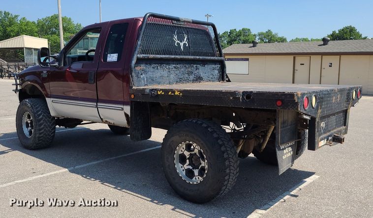 image for item DK1969 2000 Ford F250 Super Duty XLT  SuperCab flatbed pickup truck