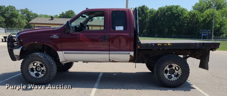 image for item DK1969 2000 Ford F250 Super Duty XLT  SuperCab flatbed pickup truck