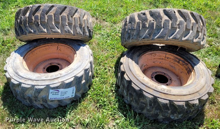 image for item DK1972 (4) Titan 10-16.5 skid steer tires and wheels