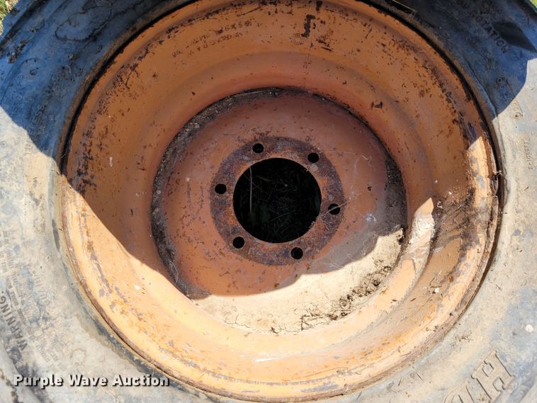 image for item DK1972 (4) Titan 10-16.5 skid steer tires and wheels