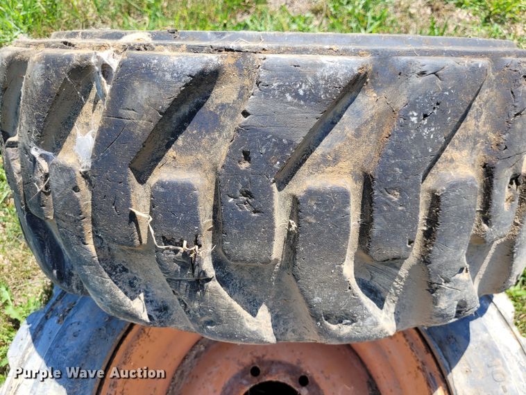 image for item DK1972 (4) Titan 10-16.5 skid steer tires and wheels