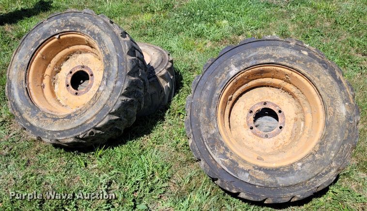 image for item DK1972 (4) Titan 10-16.5 skid steer tires and wheels