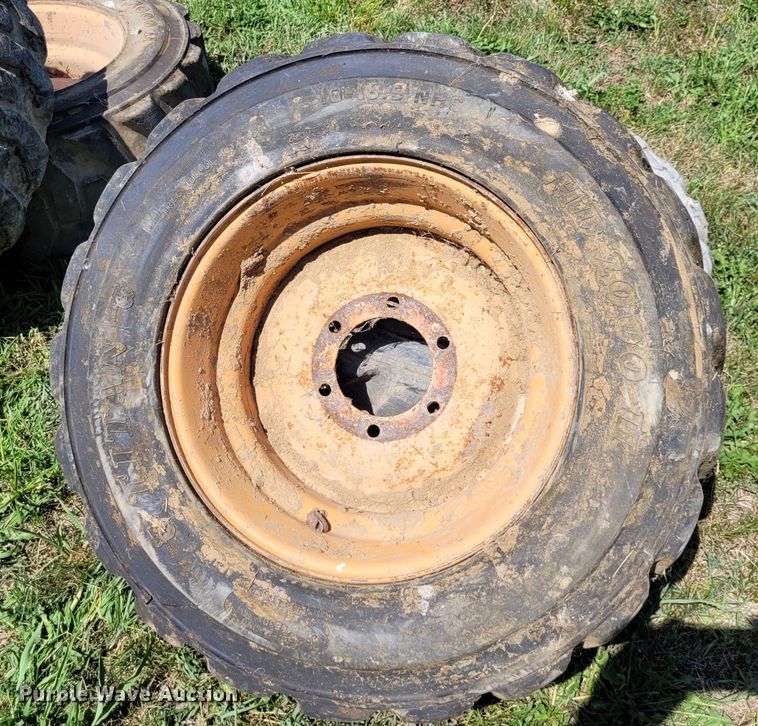 image for item DK1972 (4) Titan 10-16.5 skid steer tires and wheels
