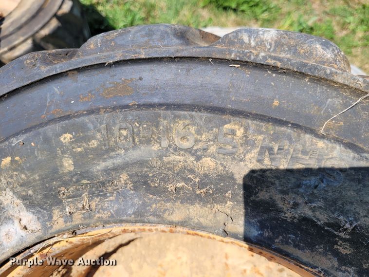 image for item DK1972 (4) Titan 10-16.5 skid steer tires and wheels