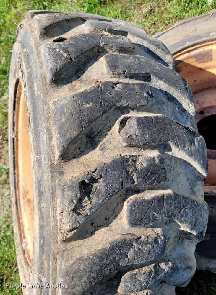 image for item DK1972 (4) Titan 10-16.5 skid steer tires and wheels