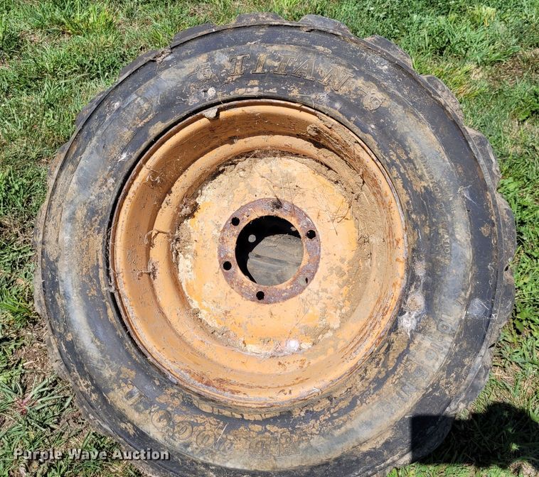 image for item DK1972 (4) Titan 10-16.5 skid steer tires and wheels