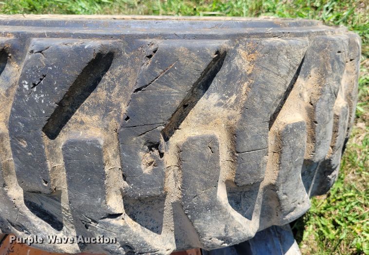 image for item DK1972 (4) Titan 10-16.5 skid steer tires and wheels