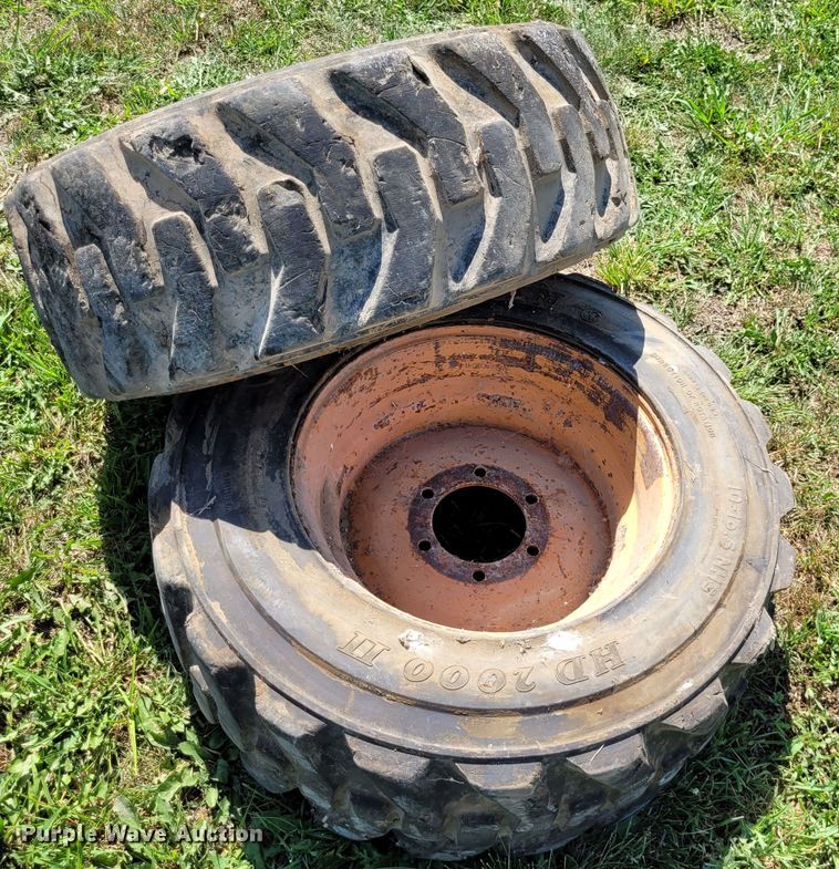 image for item DK1972 (4) Titan 10-16.5 skid steer tires and wheels
