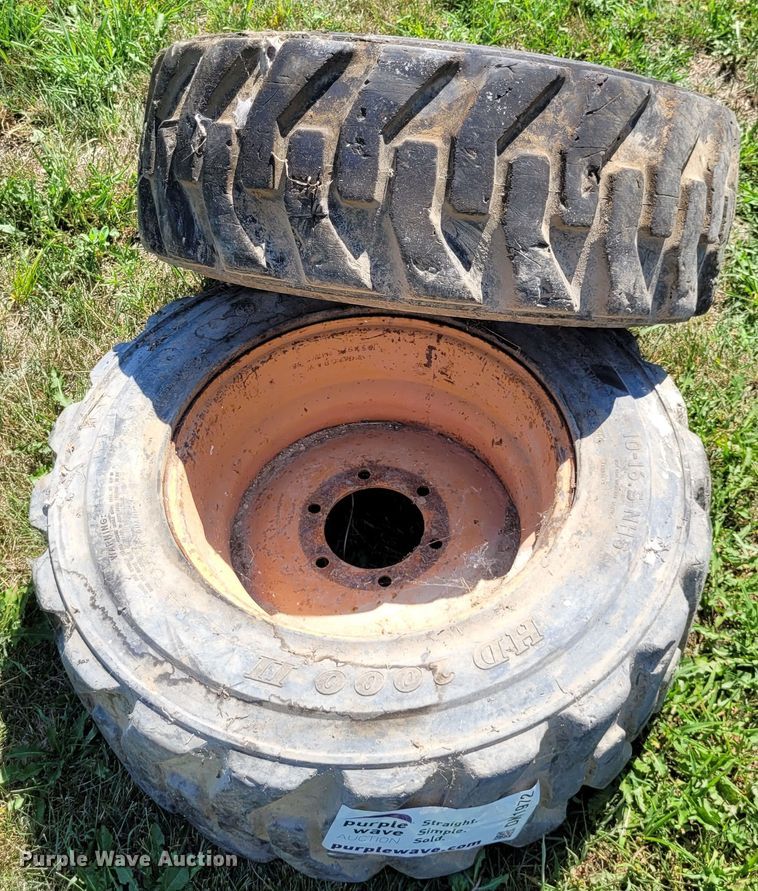 image for item DK1972 (4) Titan 10-16.5 skid steer tires and wheels