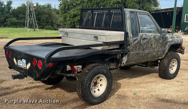 image for item DN3021 1987 Toyota Tacoma  Access Cab flatbed pickup truck