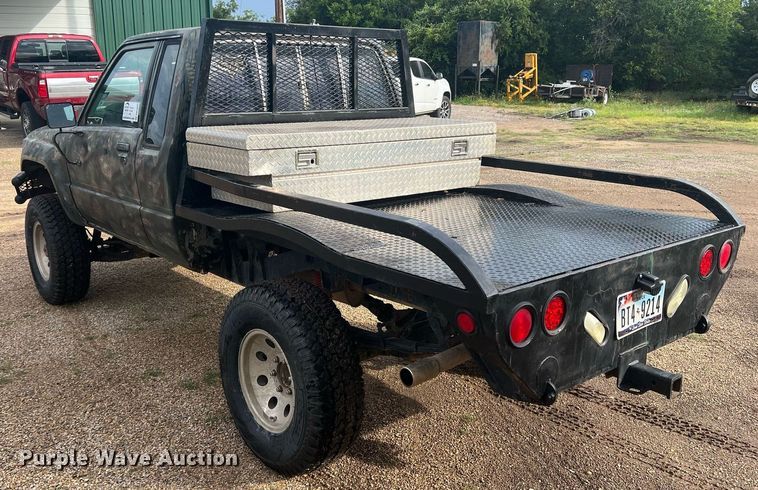 image for item DN3021 1987 Toyota Tacoma  Access Cab flatbed pickup truck