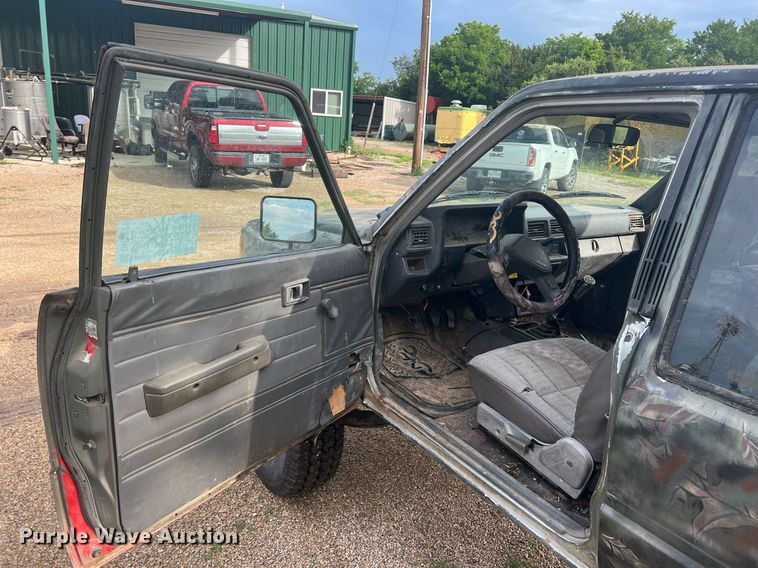 image for item DN3021 1987 Toyota Tacoma  Access Cab flatbed pickup truck