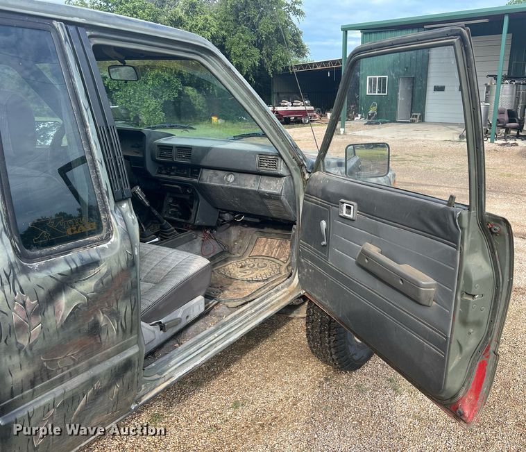 image for item DN3021 1987 Toyota Tacoma  Access Cab flatbed pickup truck