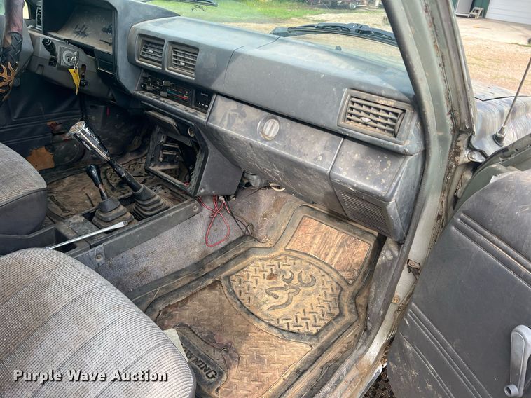 image for item DN3021 1987 Toyota Tacoma  Access Cab flatbed pickup truck