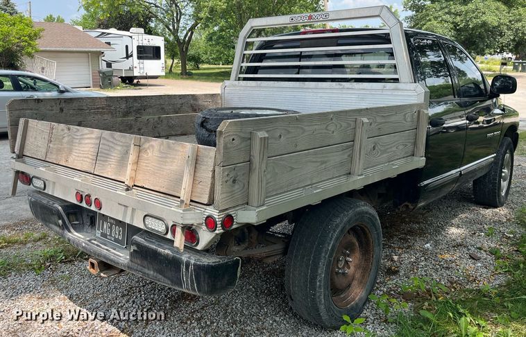 image for item DP0512 2004 Dodge Ram 1500  Quad Cab flatbed pickup truck