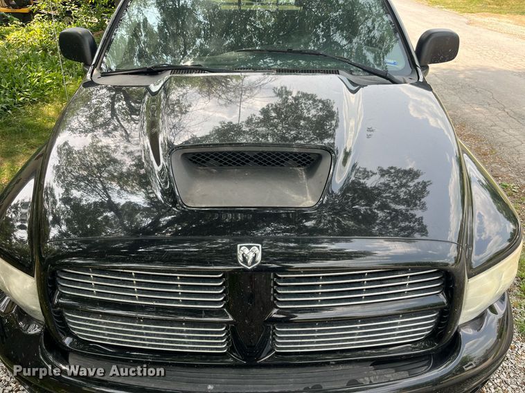 image for item DP0512 2004 Dodge Ram 1500  Quad Cab flatbed pickup truck