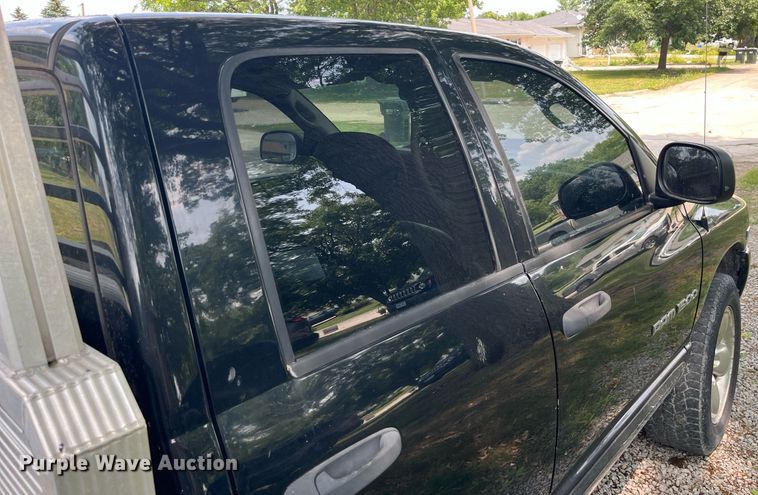 image for item DP0512 2004 Dodge Ram 1500  Quad Cab flatbed pickup truck