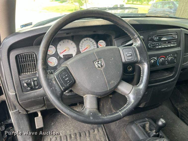 image for item DP0512 2004 Dodge Ram 1500  Quad Cab flatbed pickup truck