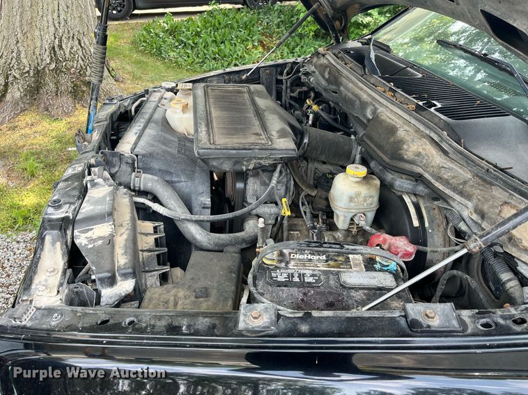 image for item DP0512 2004 Dodge Ram 1500  Quad Cab flatbed pickup truck