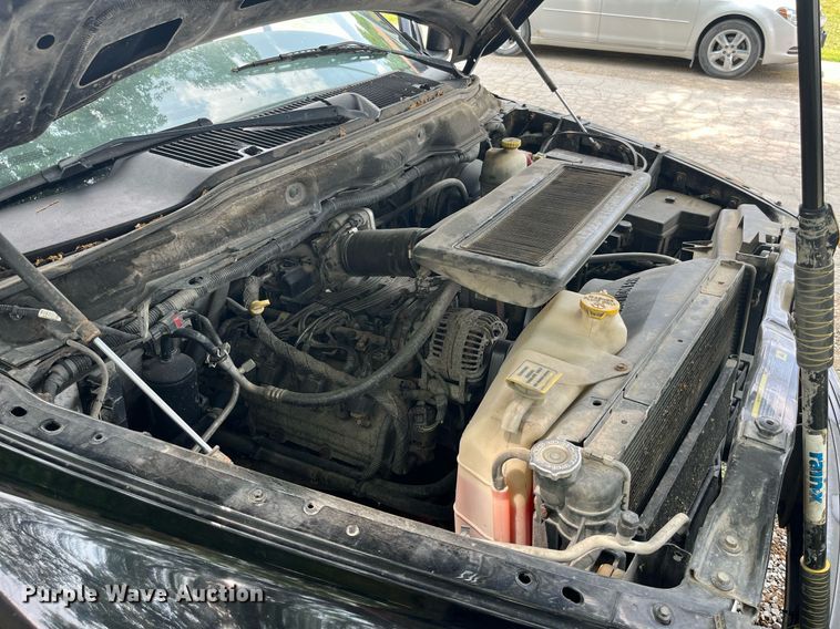 image for item DP0512 2004 Dodge Ram 1500  Quad Cab flatbed pickup truck