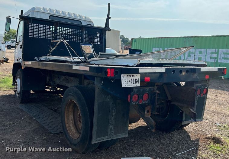 image for item DQ2085 2002 GMC T6500  flatbed truck