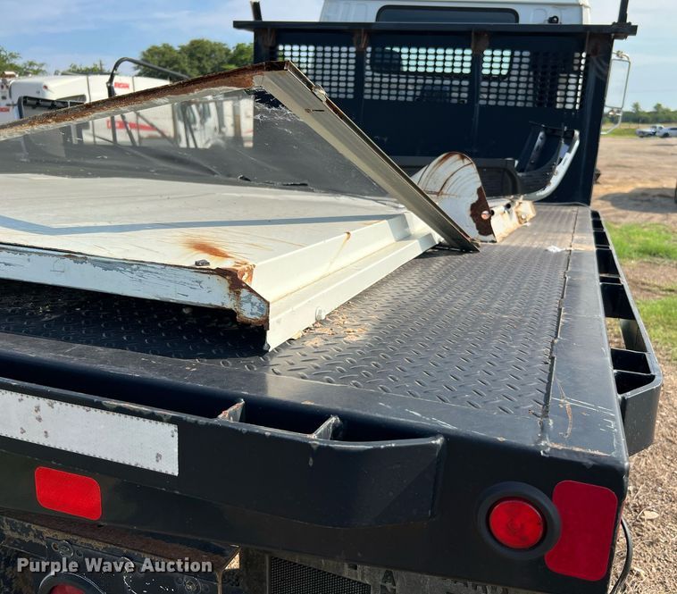 image for item DQ2085 2002 GMC T6500  flatbed truck