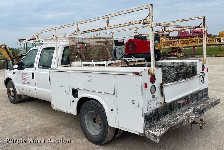 image for item LY9751 2004 Ford F350 Super Duty  Crew Cab utility bed pickup truck