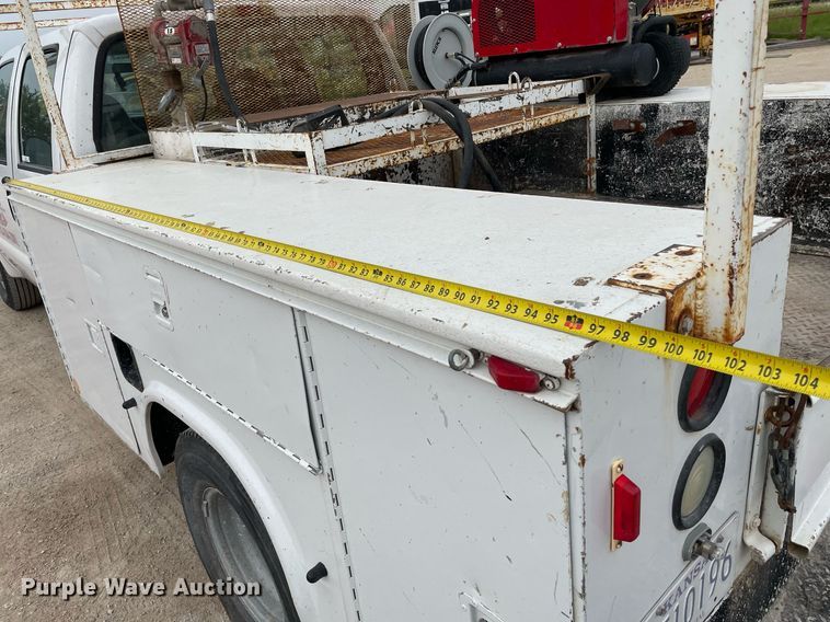 image for item LY9751 2004 Ford F350 Super Duty  Crew Cab utility bed pickup truck