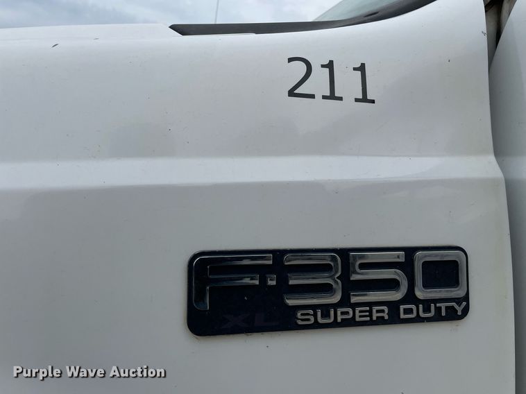 image for item LY9751 2004 Ford F350 Super Duty  Crew Cab utility bed pickup truck