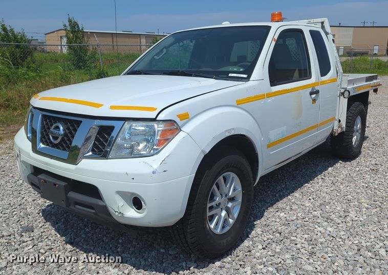 image for item MX9330 2015 Nissan Frontier  King Cab flatbed pickup truck