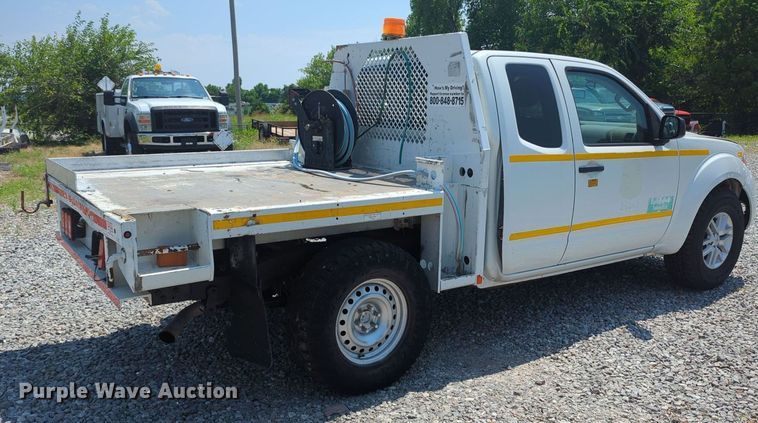 image for item MX9330 2015 Nissan Frontier  King Cab flatbed pickup truck