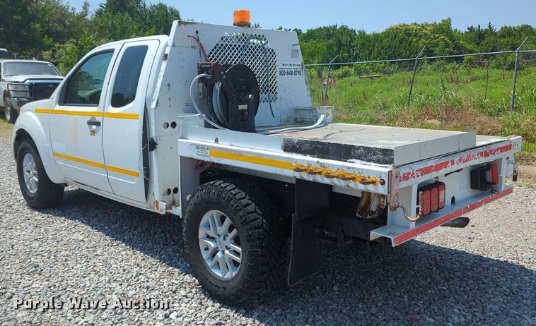 image for item MX9330 2015 Nissan Frontier  King Cab flatbed pickup truck